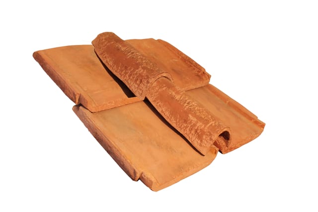 Terracotta rooftiles slotted together.