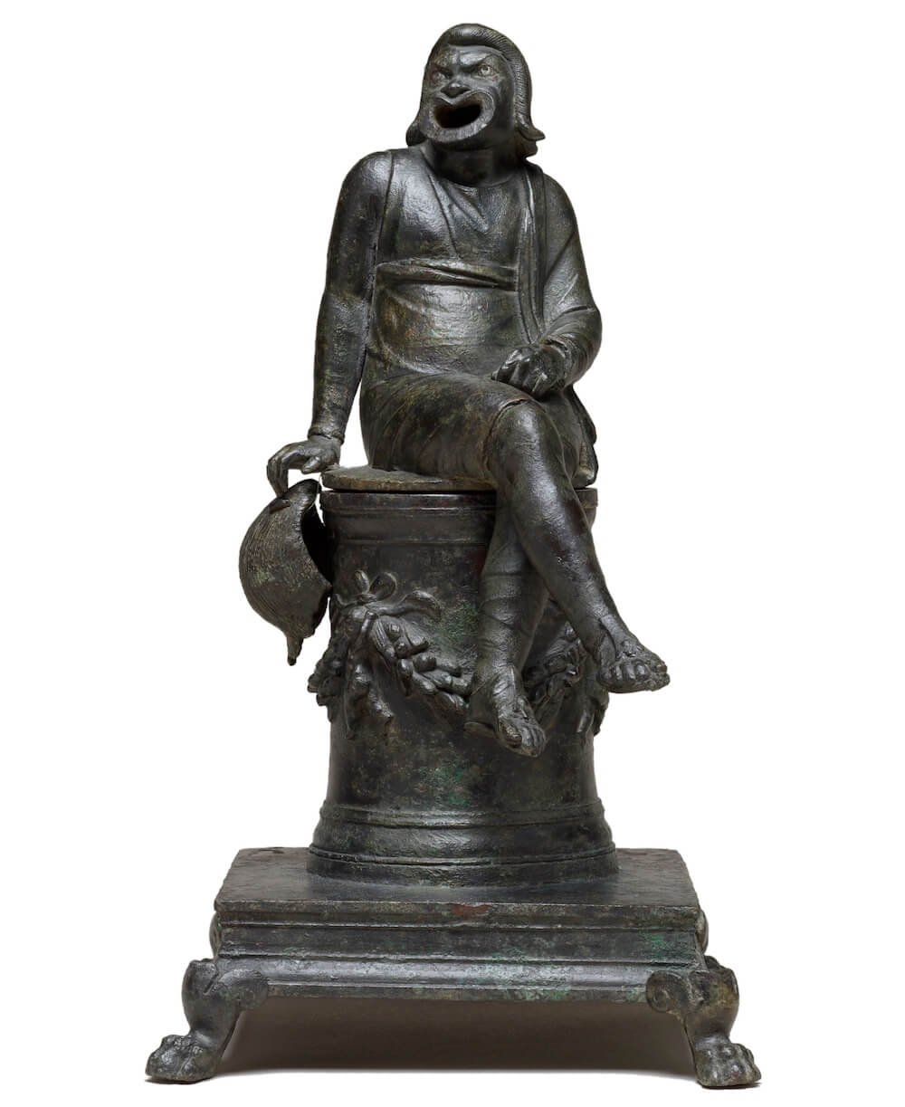 An incense burner in the shape of a comic actor