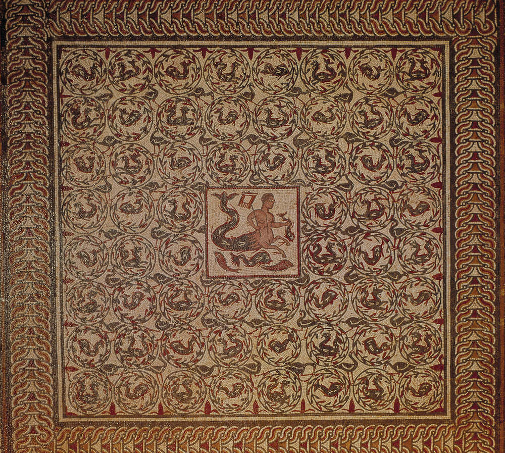 A coloured mosaic showing Triton, surrounded by a circular patterns of wreaths and sea creatures.