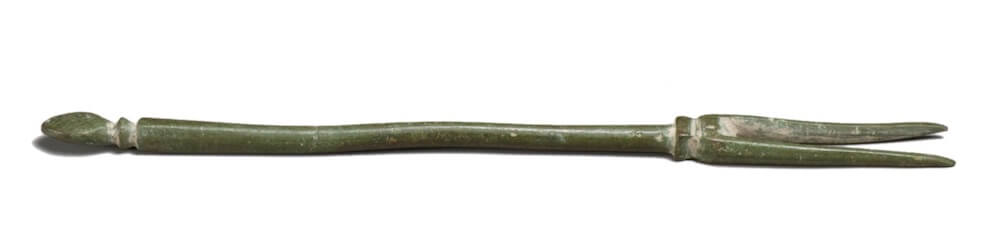 A long metal fork. It only has two prongs.