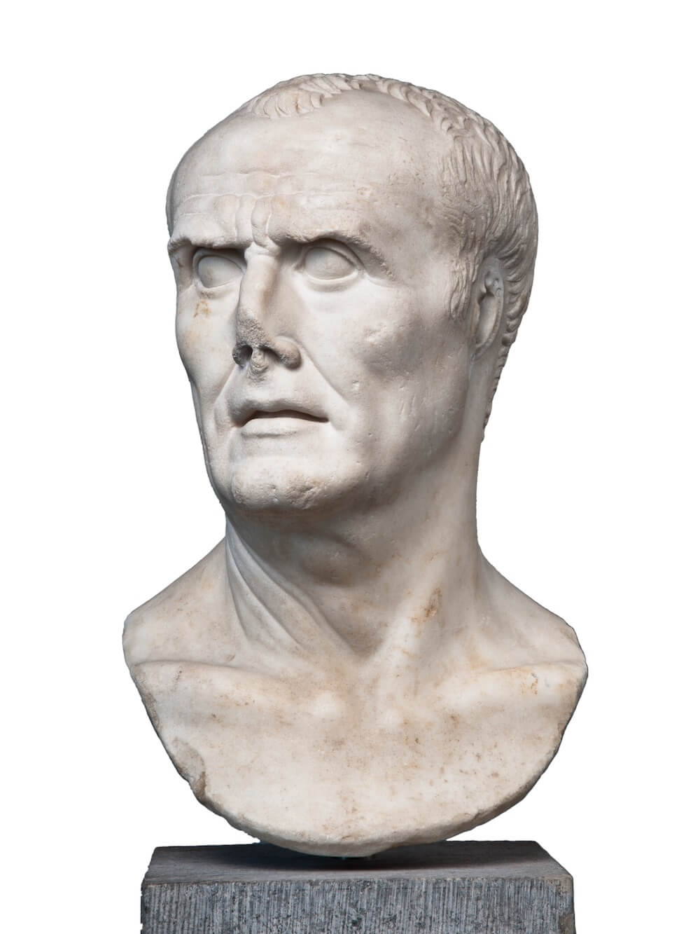 A marble bust of a man. His hair is receding and he has a furrowed brow. His nose has been broken off at the tip.