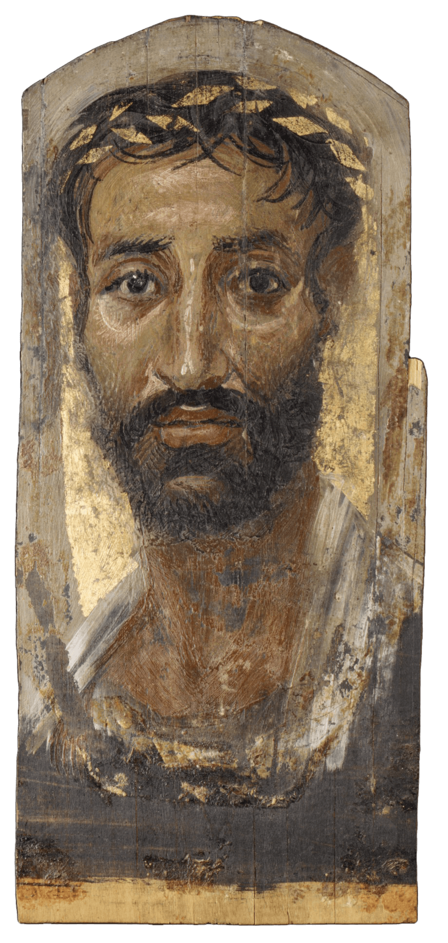 A thin piece of wood with the painted head and shoulders of a man. He has a large, long nose and a thick beard and moustage. he has a slightly concerned expression and a gold wreath is arranged on his head.