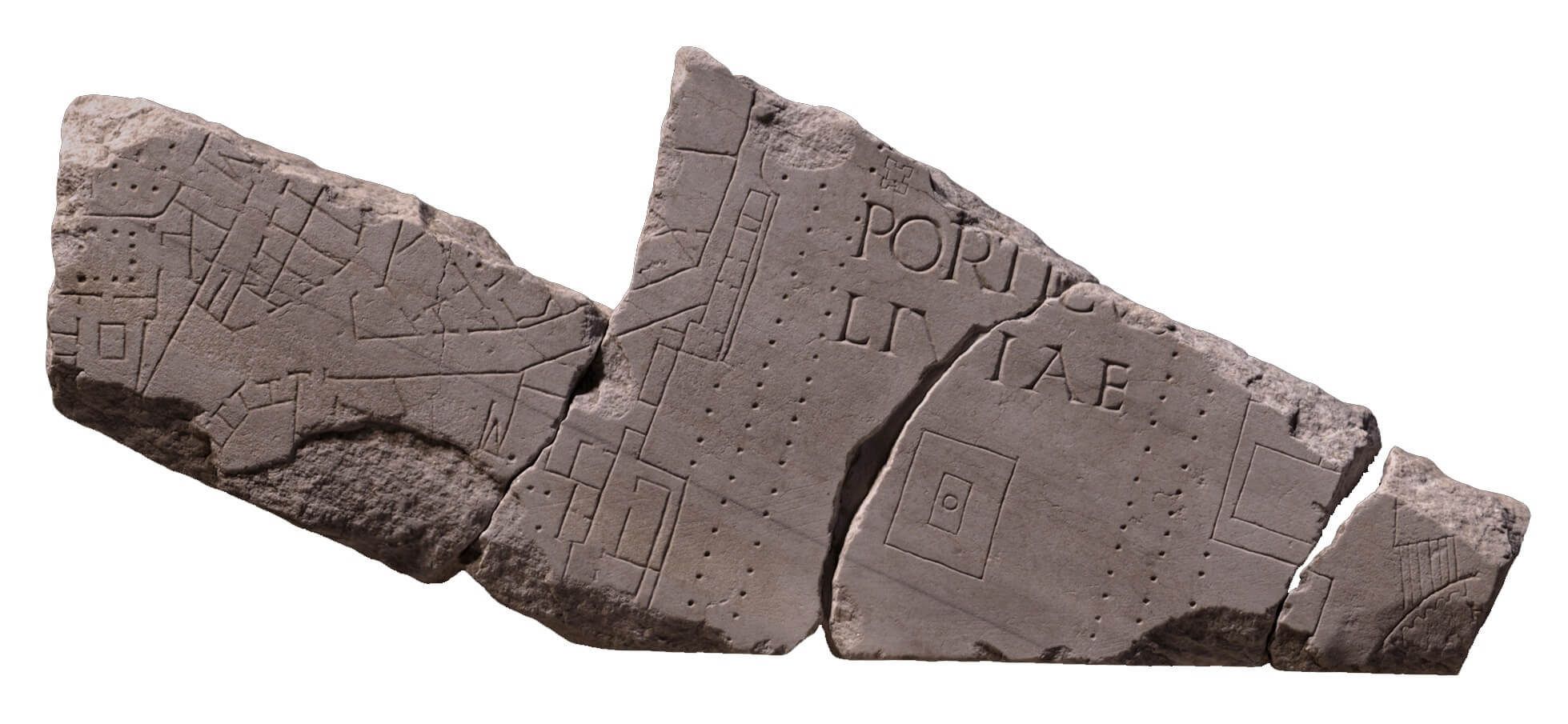 A broken stone fragment with markings on in little squares, lines, and dots.