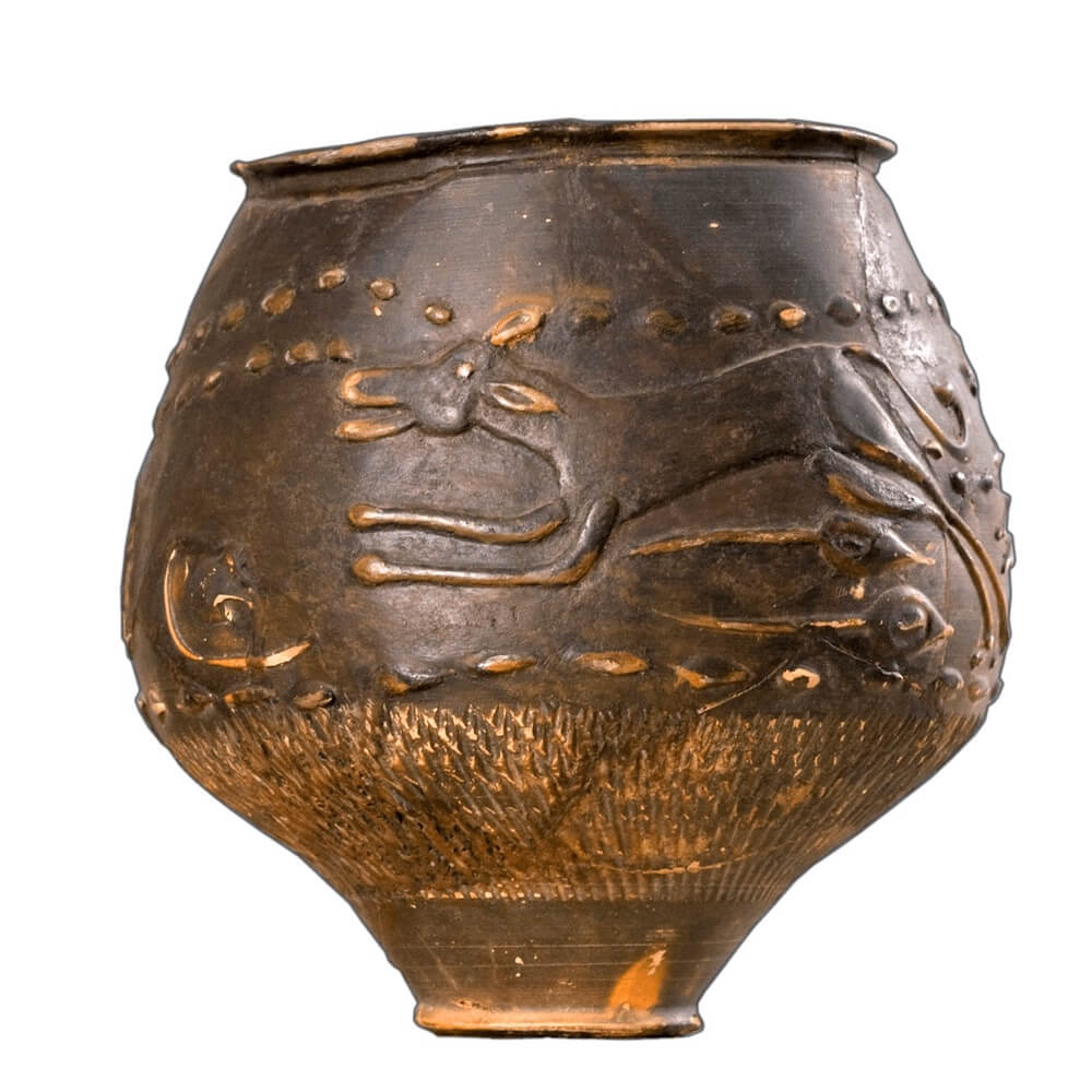 A dark ceramic cup with a narrow bottom. On the side is a dog running.