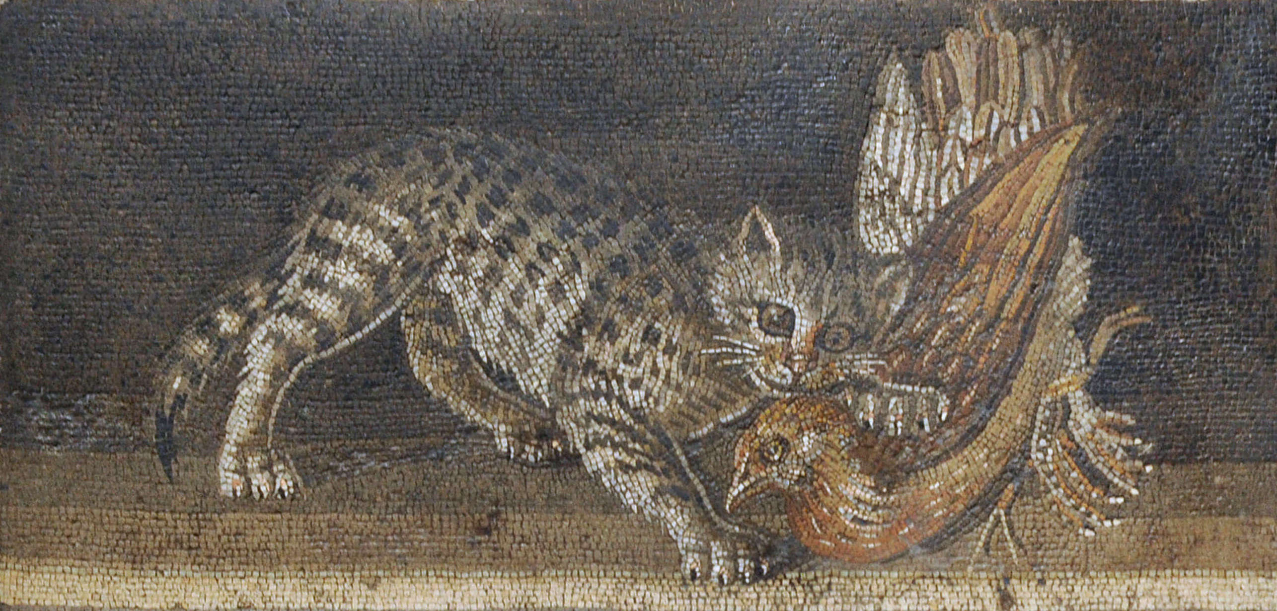A mosaic showing a domestic cat attaking a bird.