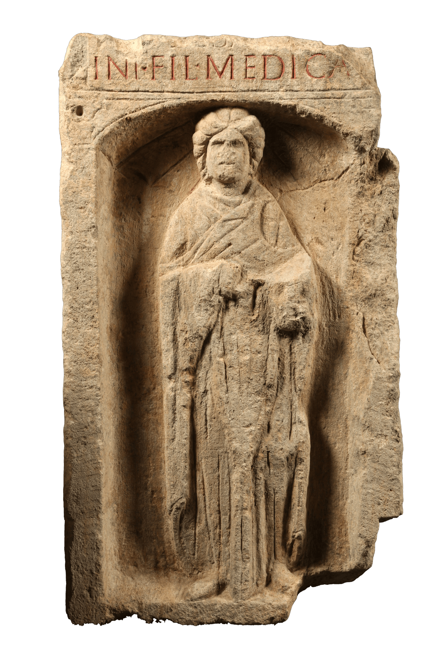 A rectangular stone marker on which is carved a woman with a lon cloak standing. Above her head the letters MEDICA are visible.