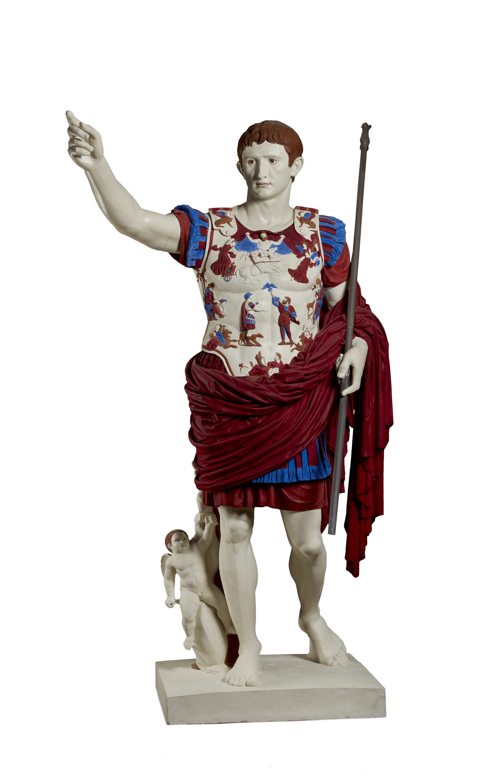 A statue of a young man dressed in armour. He lifts his right arm up and in his left holds a long rod. He does not have a helmet or sandals. The statue has been painted brightly, his skin is pale, his hair auburn, and the images on his breastplate and armour are painted in red and blue. At his right leg stands a small figure of the child Cupid.