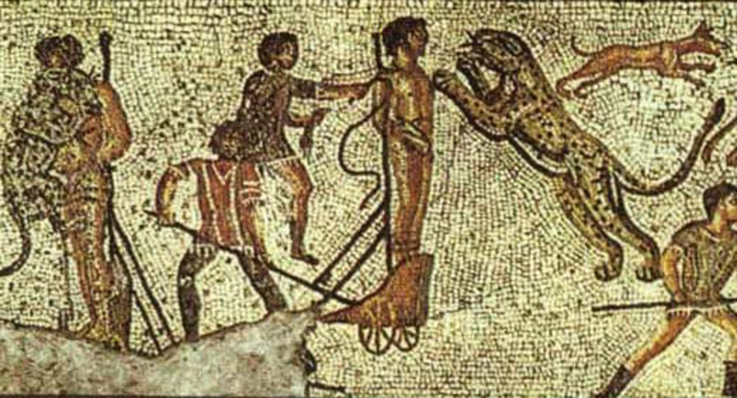 A mosaic showing a man tied to a pole being pushed on a small wheeled platform towards to lepoard which is leaping to attack.