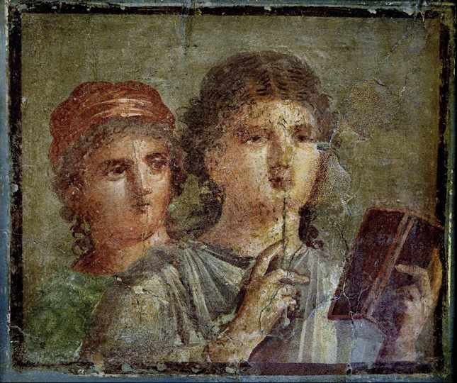 A fresco with two women looking into the distance. The woman at the front holds a writing-tablet in her left hand and holds a stylus to her looks with her right.