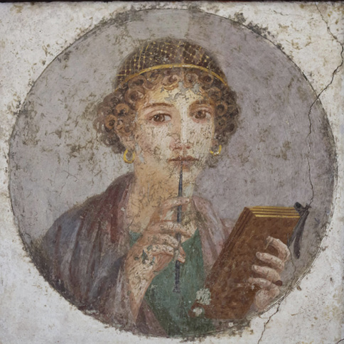 A fresco with a circular portrait showing a woman holding a writing-tablet in her left hand and holds a stylus to her looks with her right. She has a gold hairnet and gold earrings.