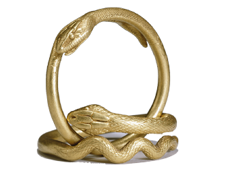 Two golden bracelets that are formed in the shape of snakes wrapping themselves around in a circle.