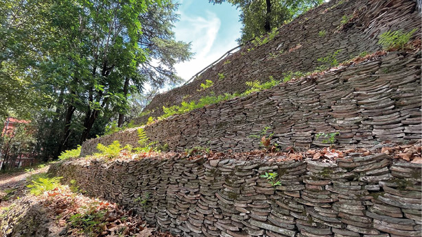 A steep hillside made up of layers and layers of broken pieces of pottery.