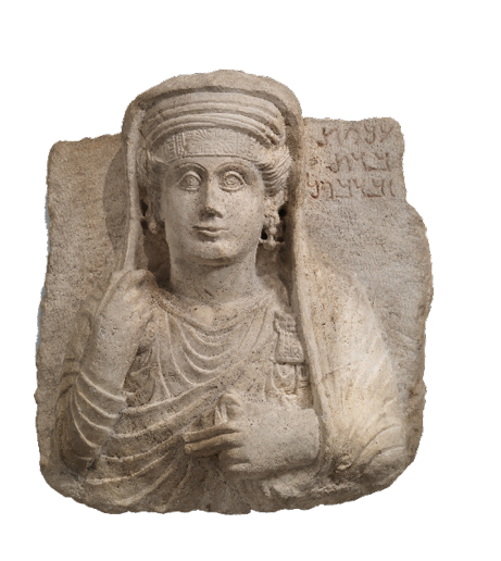 A stone relief showing a woman in elaborate clothes with a headband, earrings, and a necklace. She wears a fabric veil over her head.