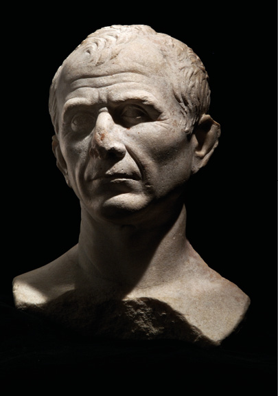 A marble bust of a man with a receding hairline and creased brow, on a black background.