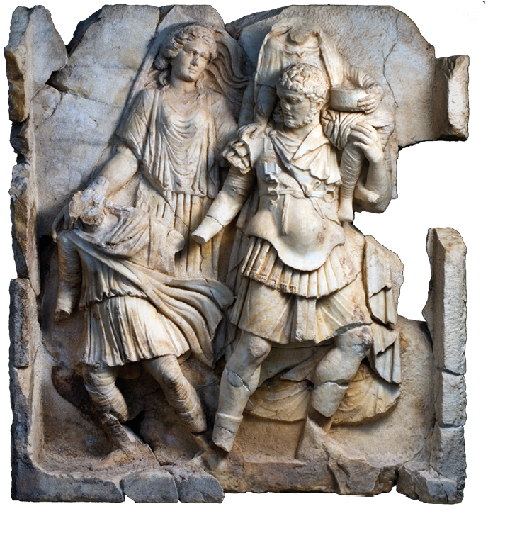 A stone relief showing a man in armor carrying another figure. By his side is a small child and behind them a woman. The relief is damaged and some parts are cracked and missing.