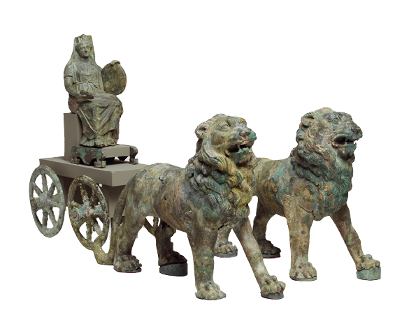 A dark metal statuette in the form of two lions with thick manes pulling a acrt on which sits a woman with a long dress and wearing a veil.
