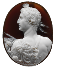 An oval disc with a dark brown background. Carved into an upper layer of bright white is a side portrait of a young man with a wreath on his head.