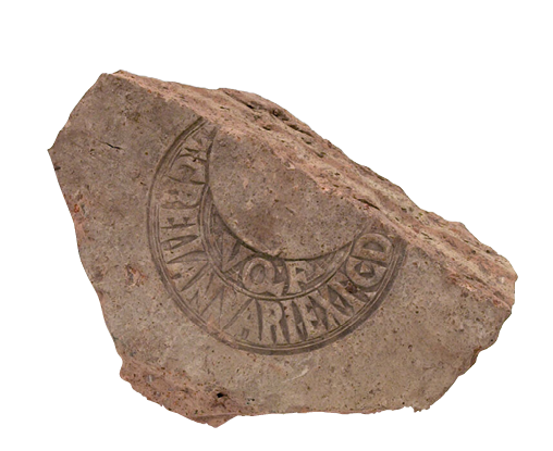 Part of a Roman brick, broken on one side. Printed on its surface is a stamp in a crescent shape with capital letters.