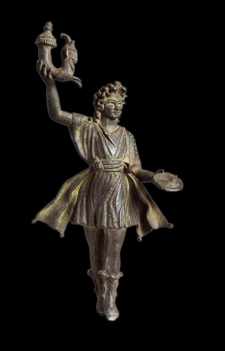 A bronze figurine of a man wearing a short tunic. In his right hand he holds a cornucopia, a curved horn, and in his left a small, circular offering.