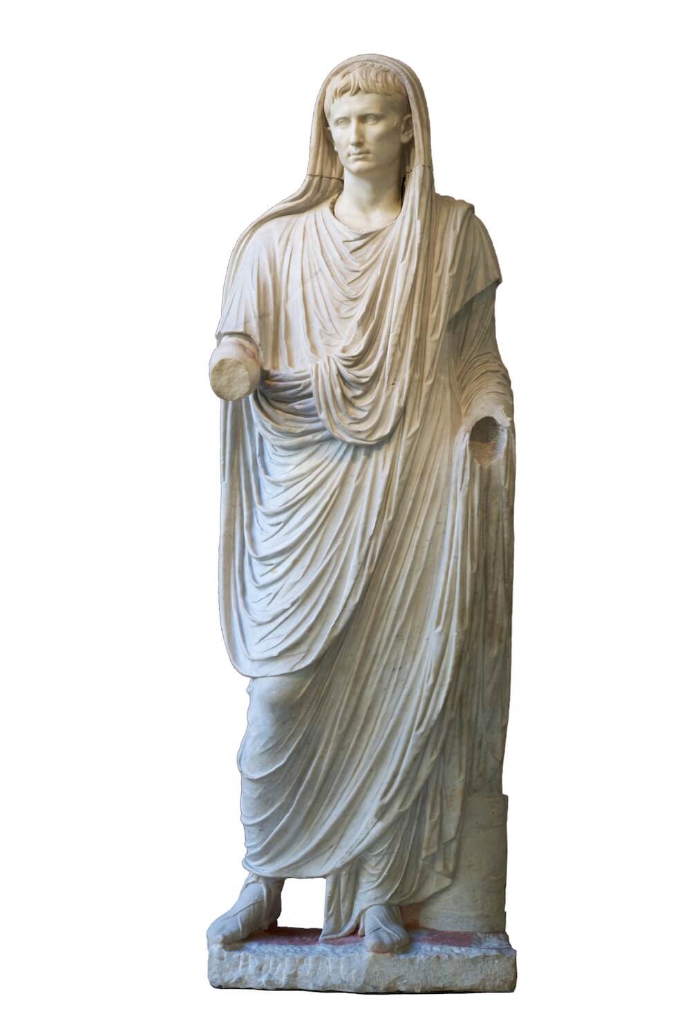 A marble statue of a man wearing a toga. Part of the material is draped over his head and his right arm is extended, although this is now broken.