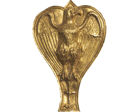 A heart-shaped ornament made of gold On which is stamped the form of an eagle with its head turned to one side and its wings open.