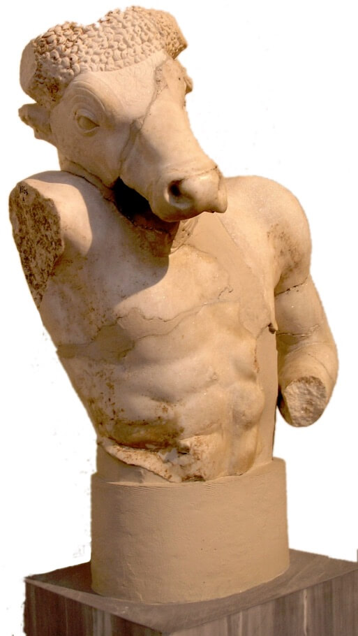 A damaged statue of the Minotaur, with one arm and both hands missing.