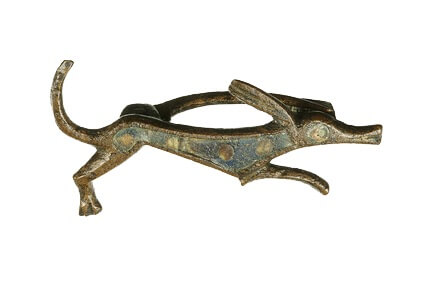 Metal Celtic brooch in the shape of a stylised hunting dog.