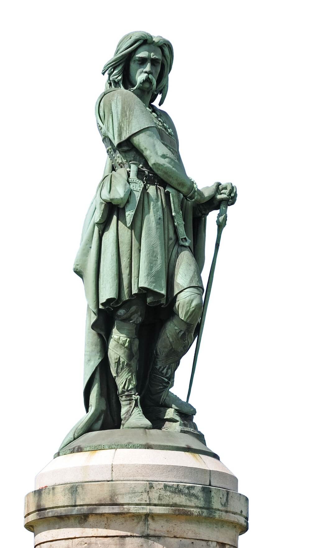 A statue of a man leaniing on his sword. He has long hair and a long moustache.